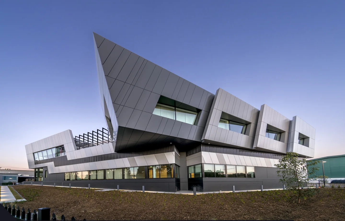 The angular silver facade of Equinix SY4 in Alexandria, Sydney